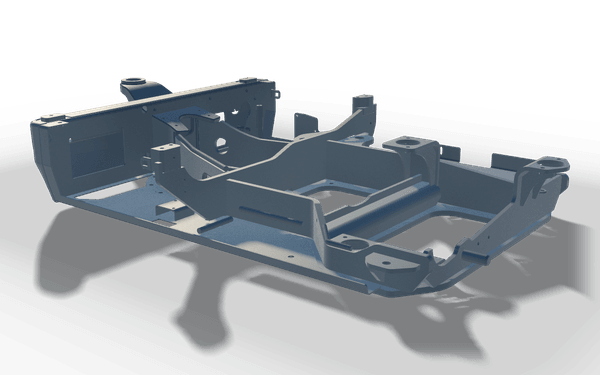 Welded chassis in its machined state, in raw steel: the bearing seats and mounting faces cut flat after welding, on a low plated frame.